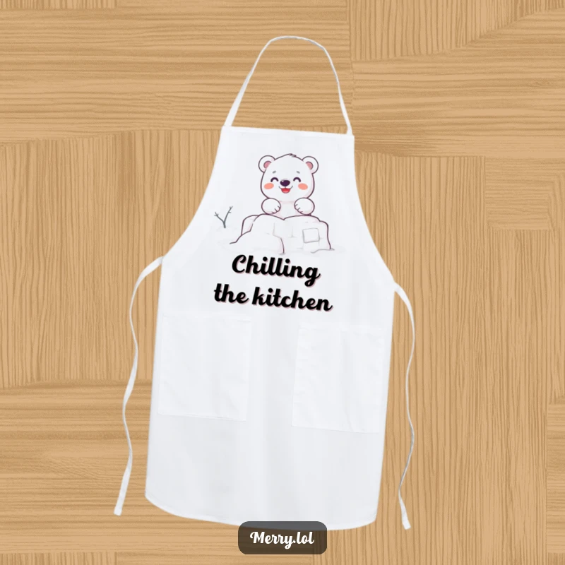 Funny apron depicting a cute polar bear character enthusiastically building a snow fort, perfect for a fun and festive kitchen.