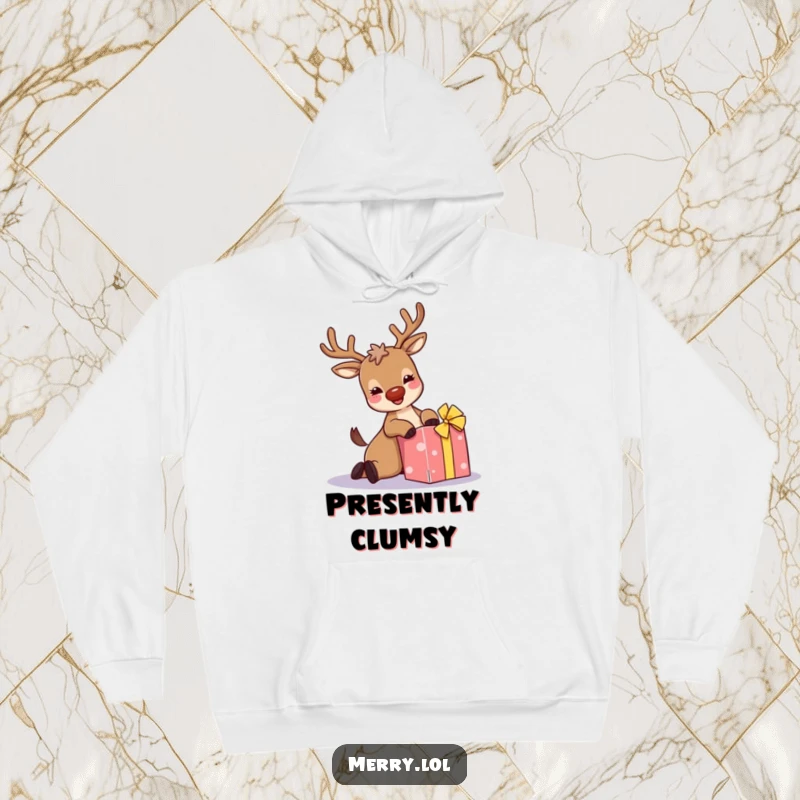 Funny hoodie: A giggling reindeer with sparkly antlers comically trips over a present, symbolizing festive clumsiness and holiday joy.