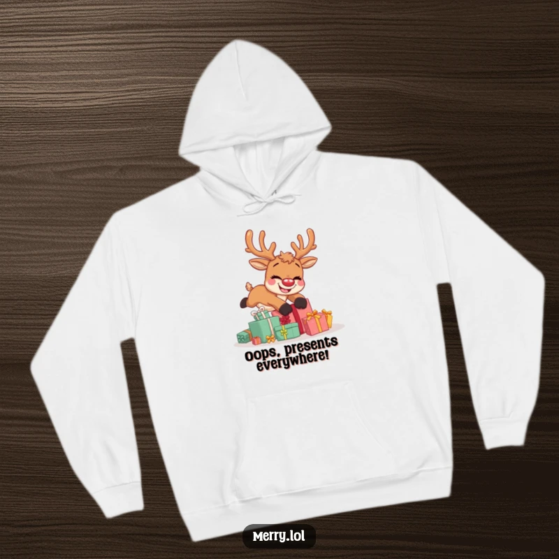 Funny hoodie showcasing a cute reindeer character tumbling over Christmas presents, looking incredibly goofy and happy.