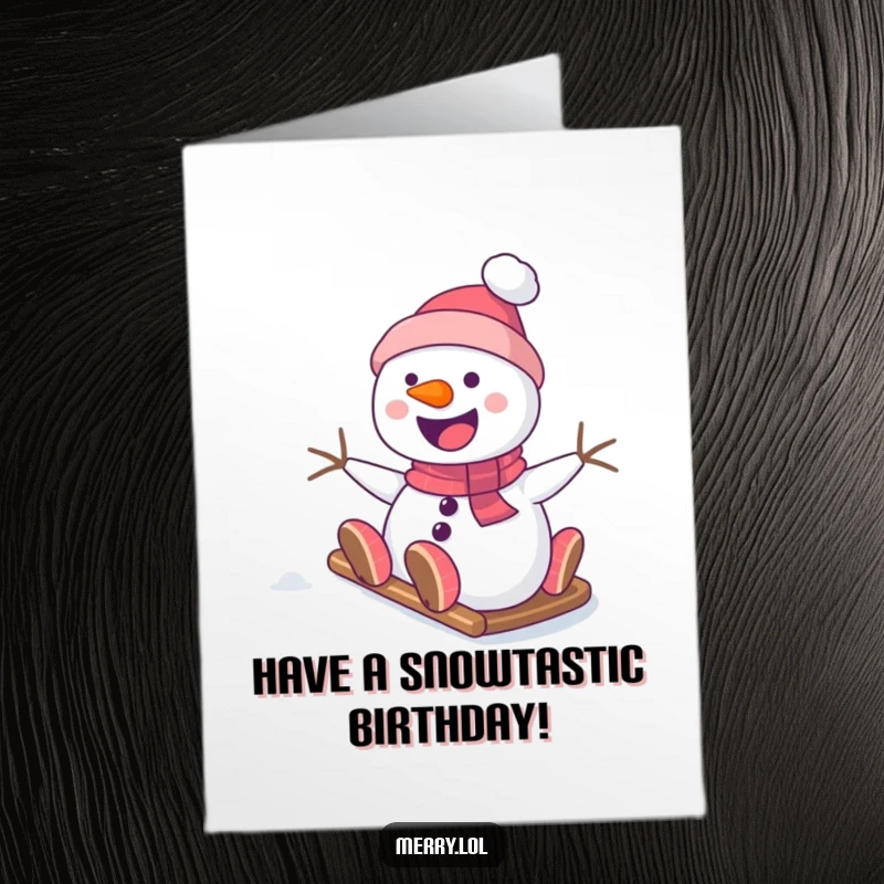 Funny Free Printable Birthday Card: A smiling snowman gleefully slides down a snowy hill, bringing birthday cheer.