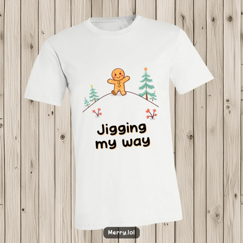 Funny gingerbread man T-Shirt with a happy character doing a jig on a snowy hill, celebrating holiday cheer.