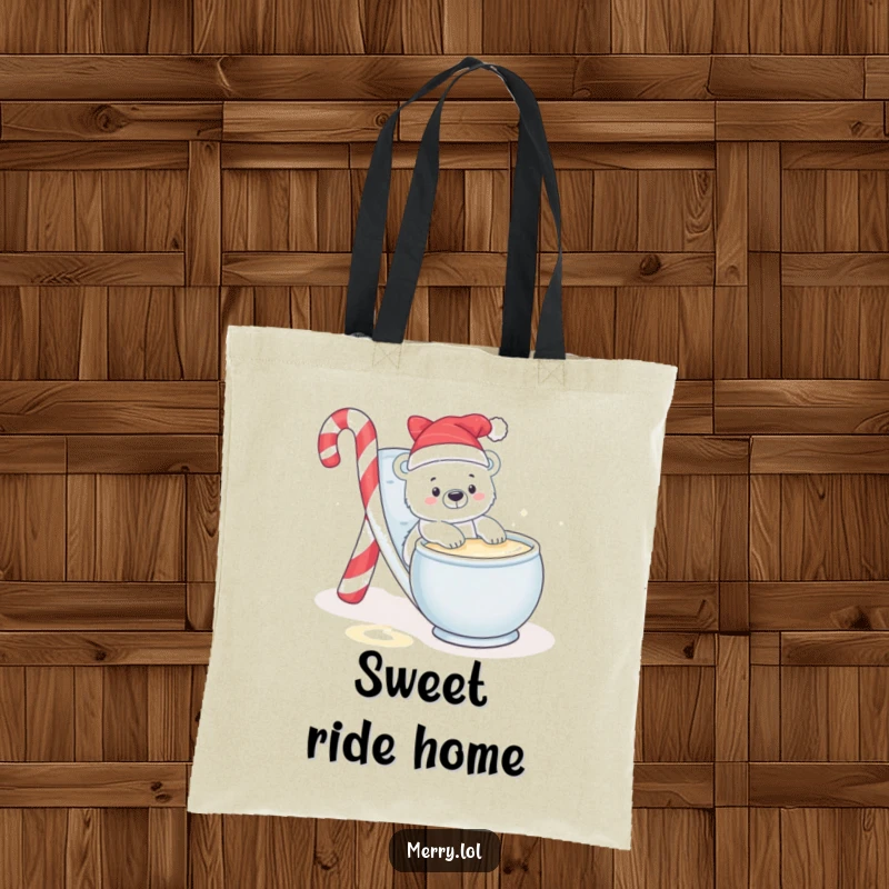 Funny tote bag featuring a baby polar bear character mid-slide down a candy cane into a bowl of eggnog, looking joyful.